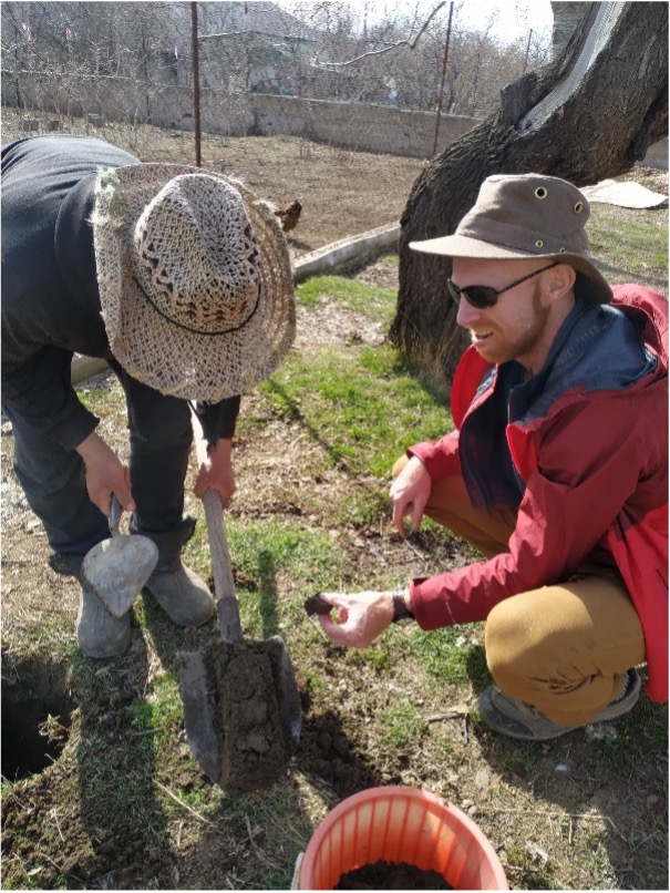 Zach Mermel gathers soil samples for analysis